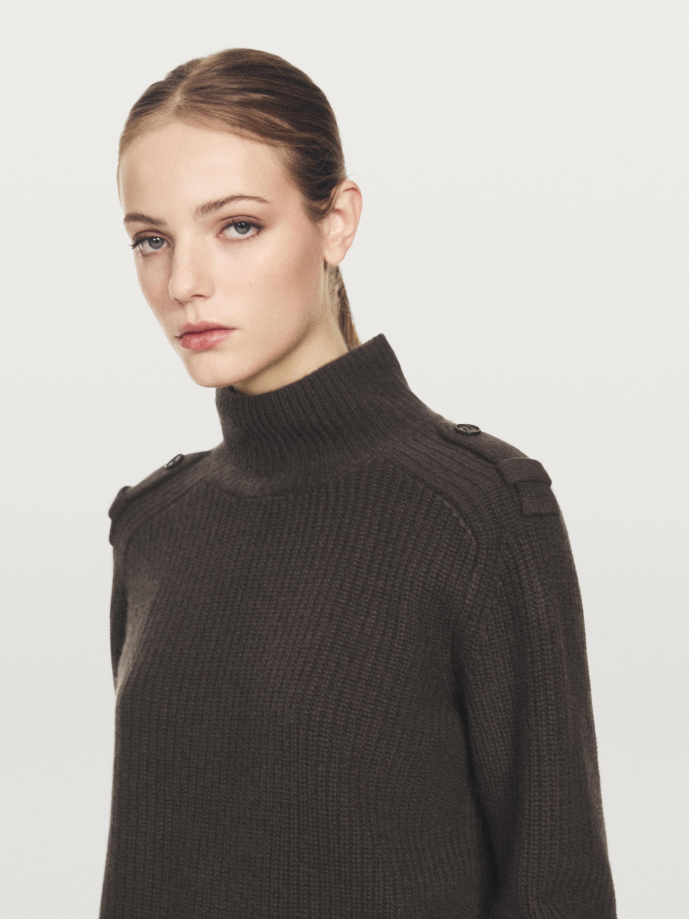Knit sweater with shoulder detail